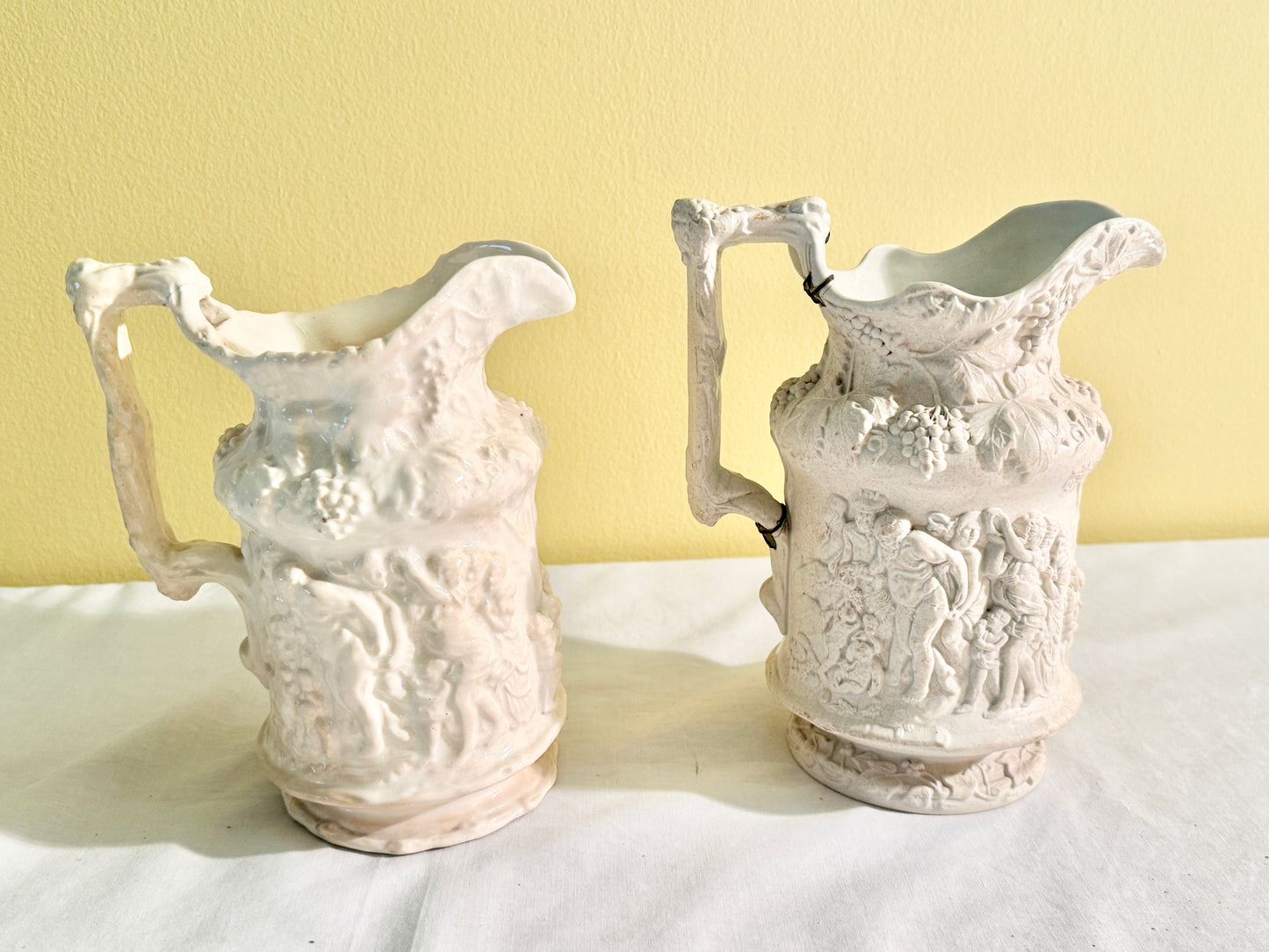 Pair of White Decorative Pitchers