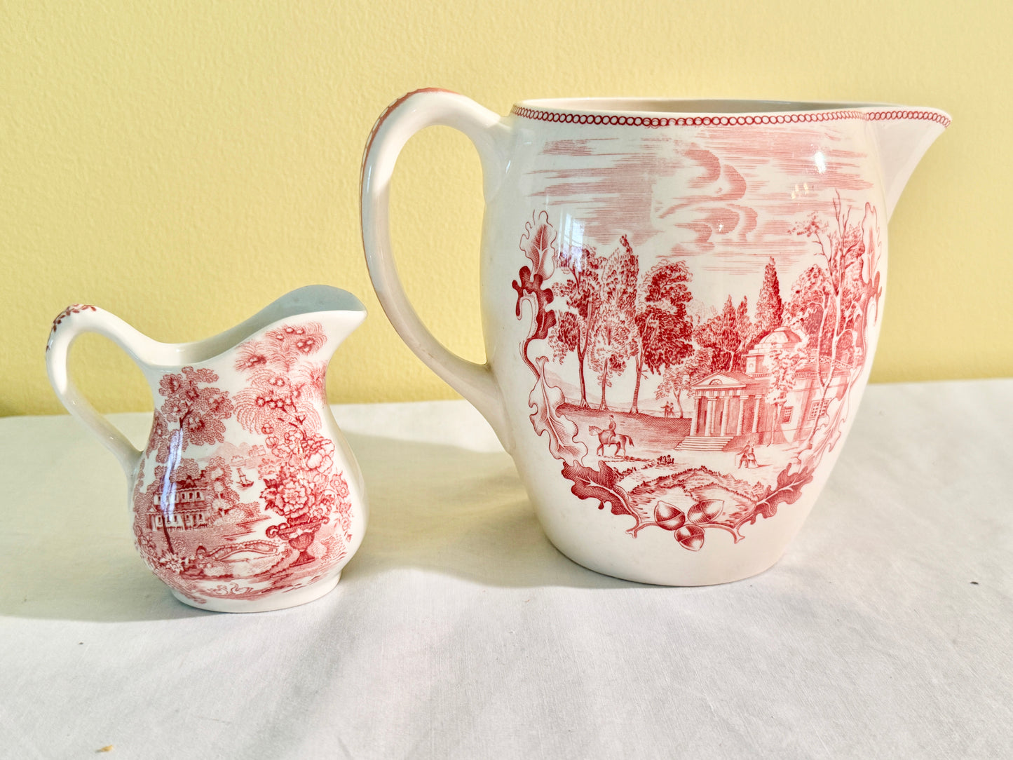 Pair of Red and White Pitchers