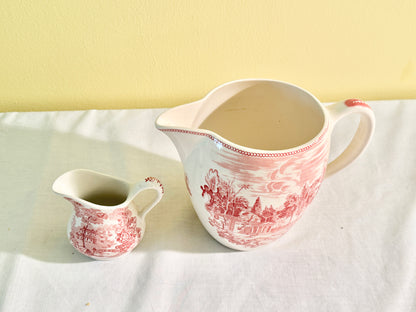 Pair of Red and White Pitchers