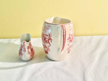 Pair of Red and White Pitchers