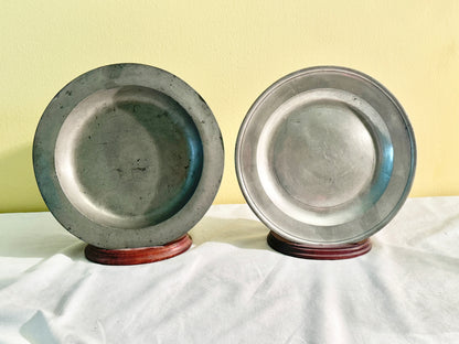 Pair of pewter plates with stands