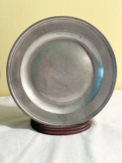 Pair of pewter plates with stands