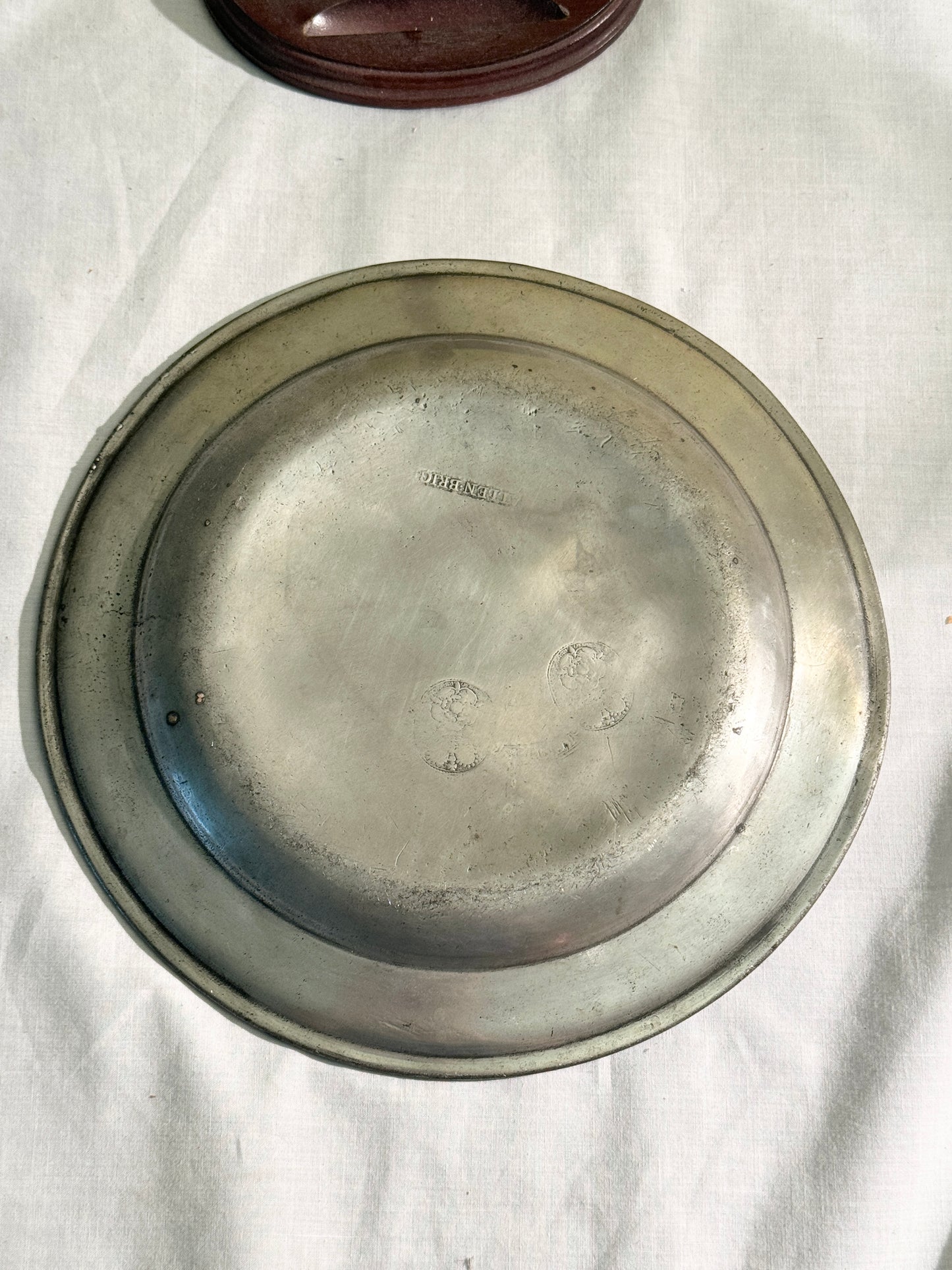 Pair of pewter plates with stands