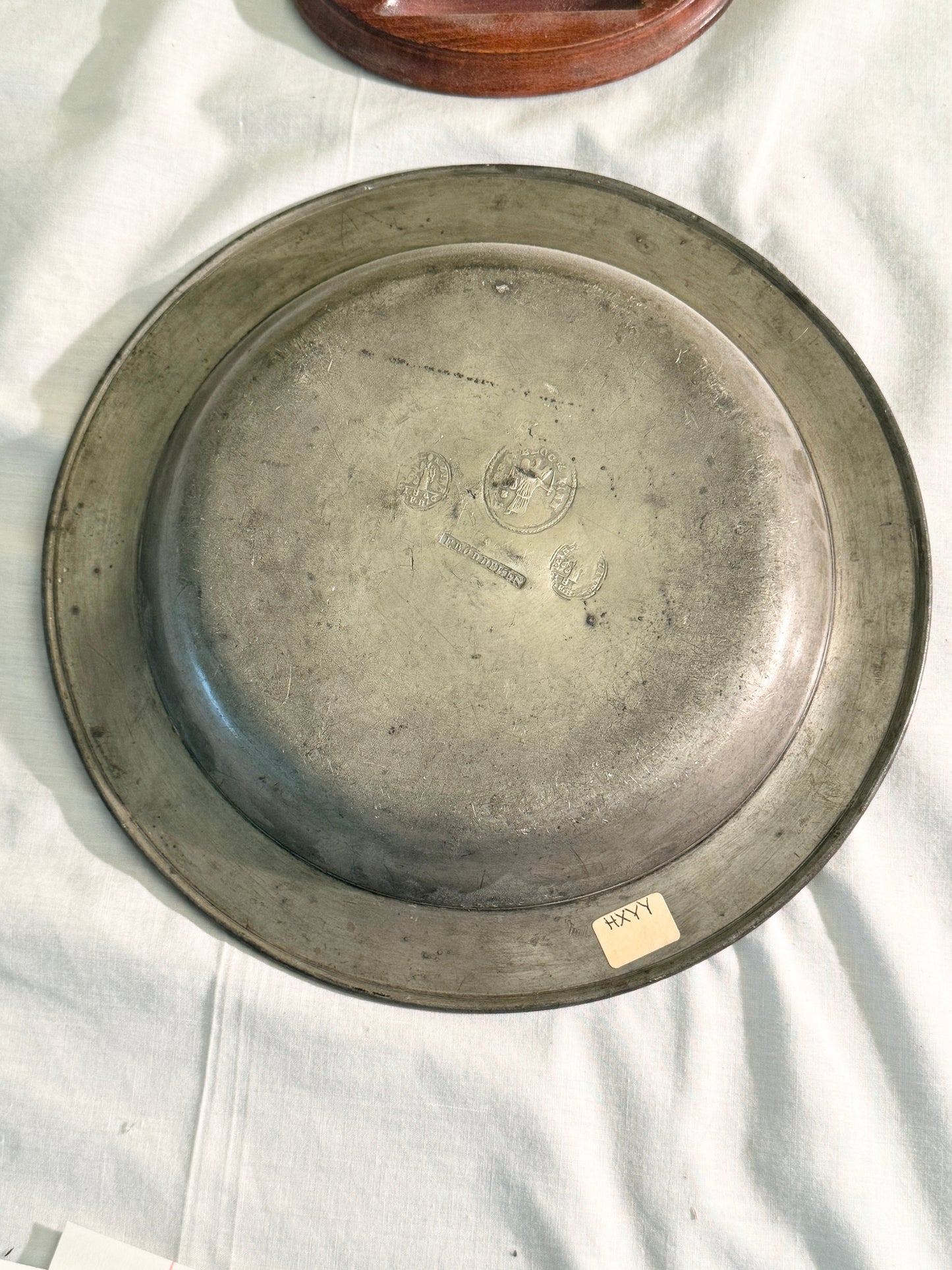 Pair of pewter plates with stands